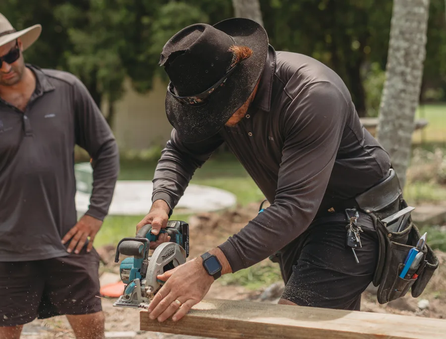 On-site detail work — every paling cut and set by hand.