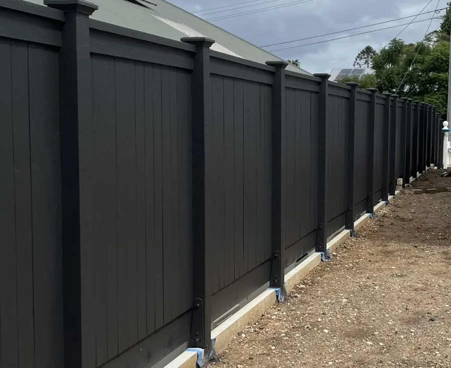 Modern black-painted boundary fence — full property side, capped posts.