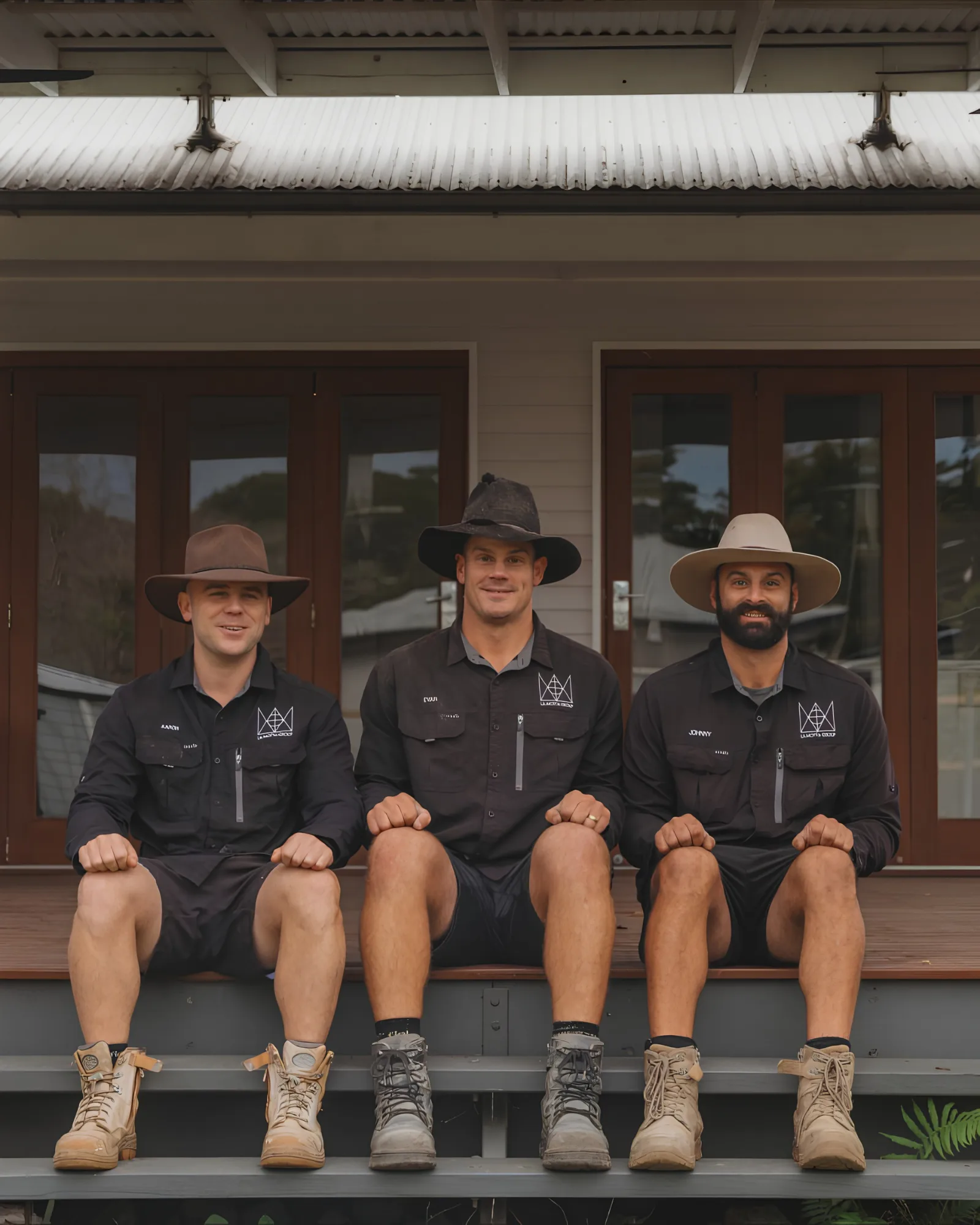 Aaron, Evan and Johnny — the La Motta Group team on a Brisbane Queenslander verandah